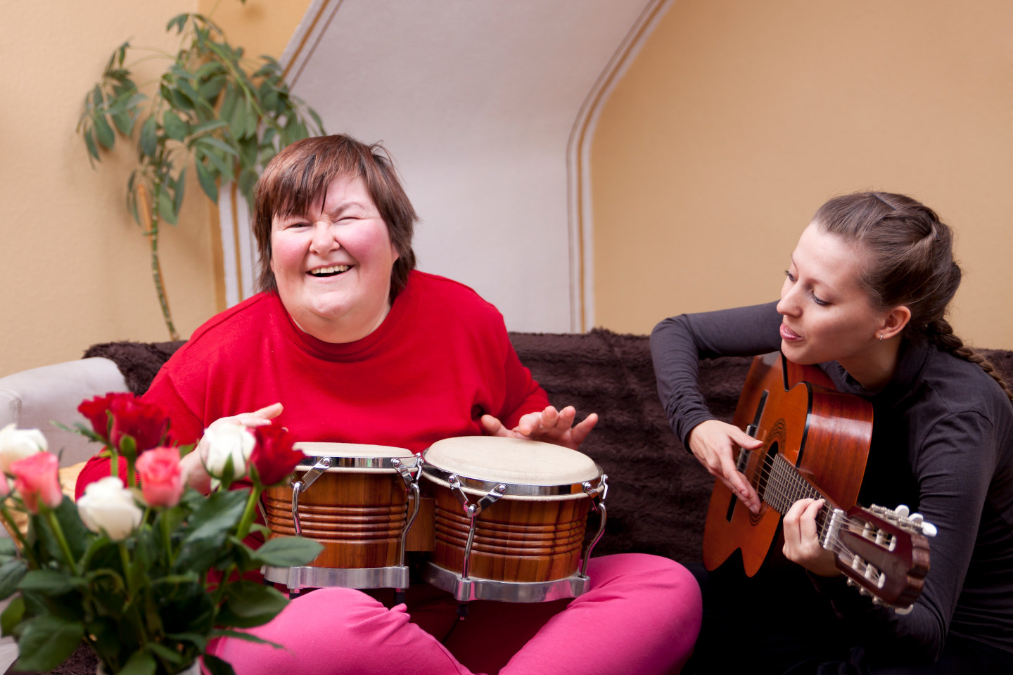 Two women make a music therapy and having fun